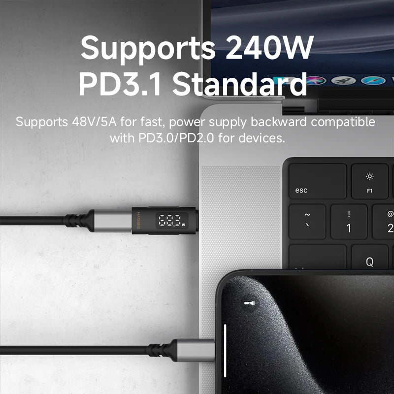 Laptop with a power cable connected, displaying technical specifications on screen.