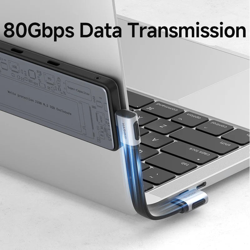 Laptop with a USB-C cable connected, highlighting 80Gbps data transmission.
