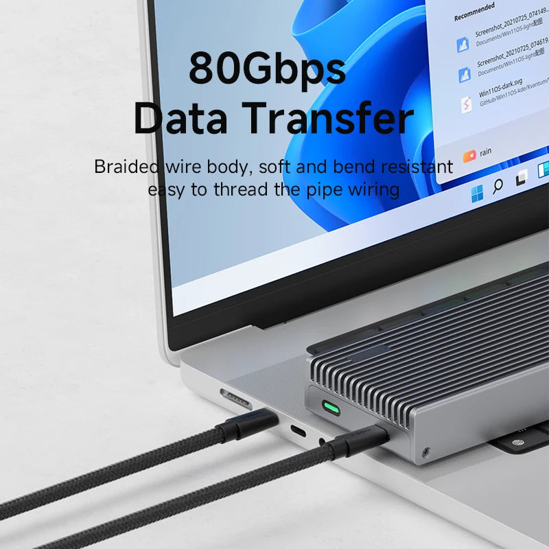 Laptop with a USB cable connected, emphasizing 80Gbps data transfer capability.