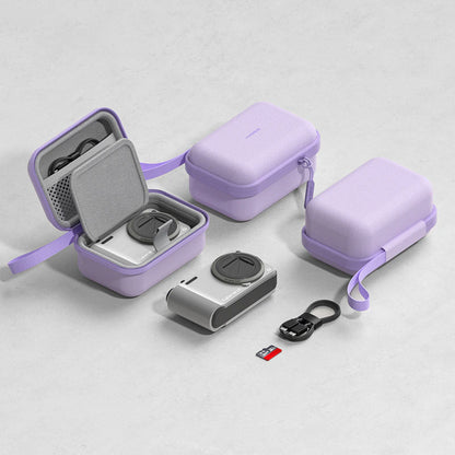 Three lavender purple protective camera cases with carrying straps, shown open and closed on a light gray textured background, alongside a silver camera lens, a black USB cable, and a small memory card.