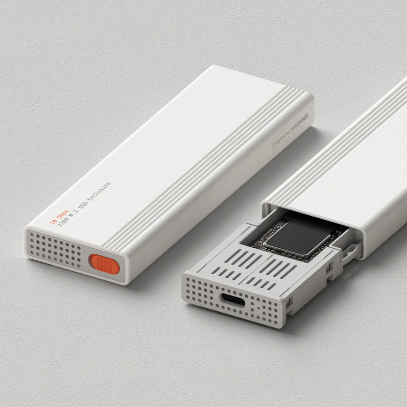 Two white rectangular electronic accessories on a light gray background, one closed with a small orange switch and one open showing a black card inside.