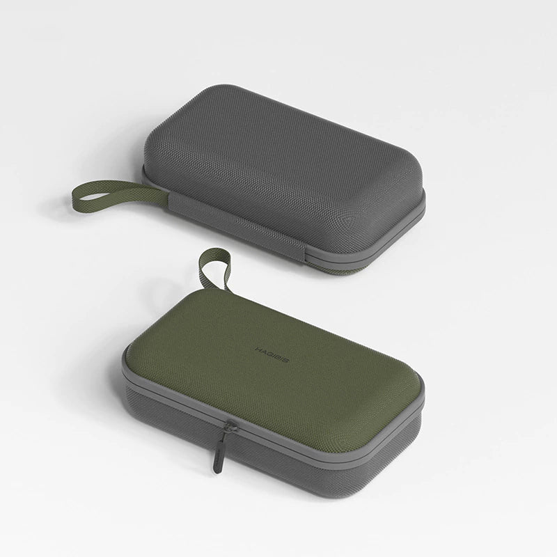 Two carrying cases, one gray and one green, on a light gray background.