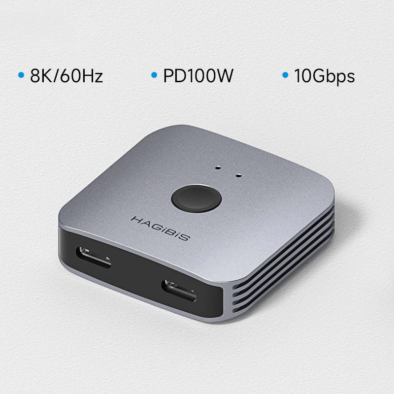 Silver electronic device with ports and specifications on a light gray background