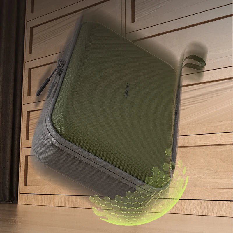 Green and gray suitcase on a wooden floor with a hexagonal pattern overlay