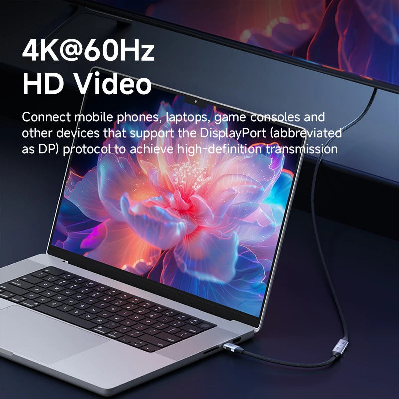 Laptop with a colorful display and text about 4K@60Hz HD video capabilities.