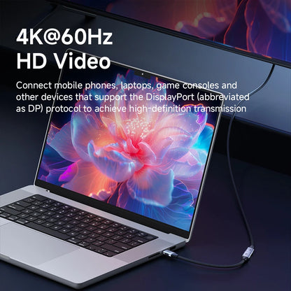 Laptop with a colorful display and text about 4K@60Hz HD video capabilities.