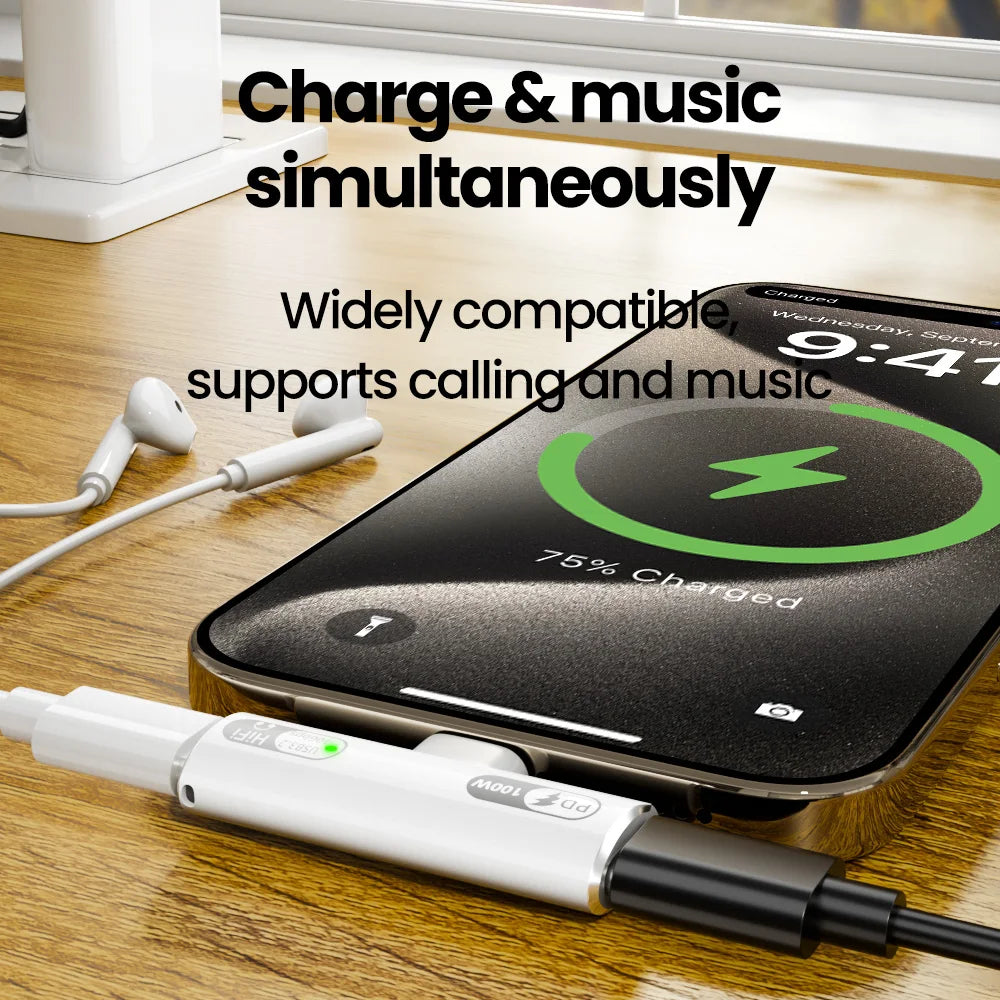 Wireless charging pad with smartphone and earbuds on a wooden surface