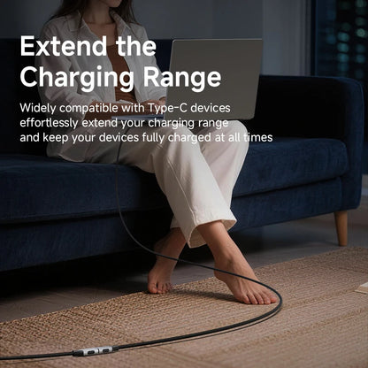 Person sitting on a couch using a laptop with text about extending charging range.