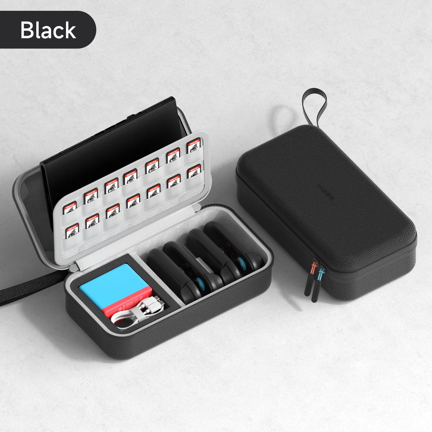 Black travel case with compartments for small items on a light gray background