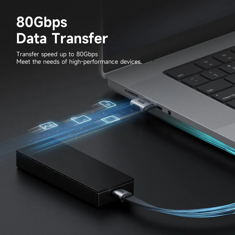 Laptop with external hard drive connected, showcasing 80Gbps data transfer capability.