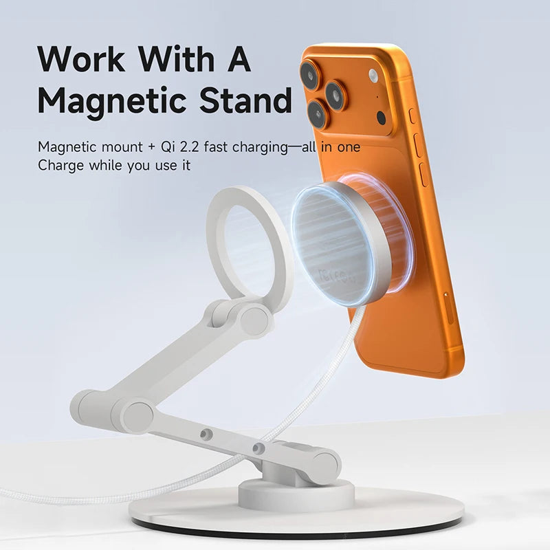 Orange phone on a white magnetic stand with text about magnetic mount and Qi charging.