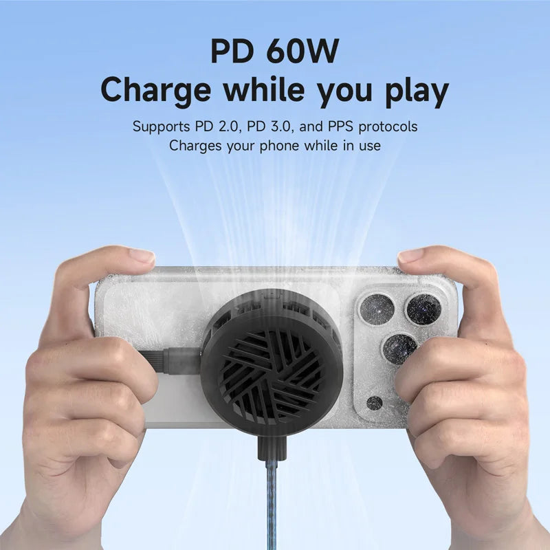 Hands holding a gaming device with a cooling fan, connected to a power cable, on a light blue background.