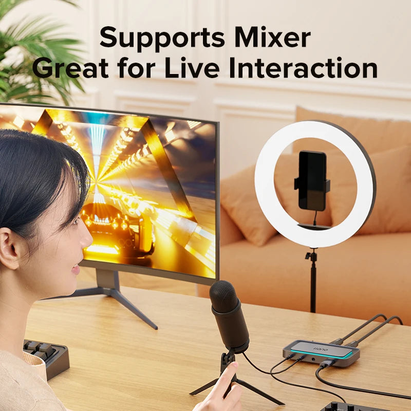 Person using a computer setup with a microphone and ring light, text indicating support for Mixer and live interaction.