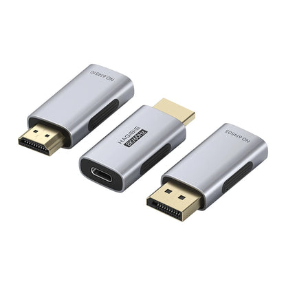 Three HDMI adapters on a white background