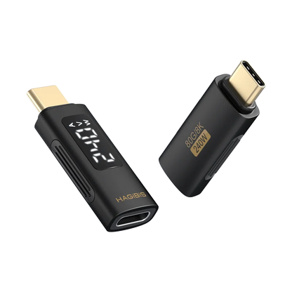 Two black electronic devices with gold connectors on a white background