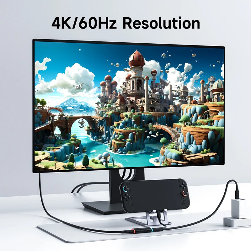 Monitor displaying a vibrant game scene with 4K/60Hz resolution text, connected to a smartphone.