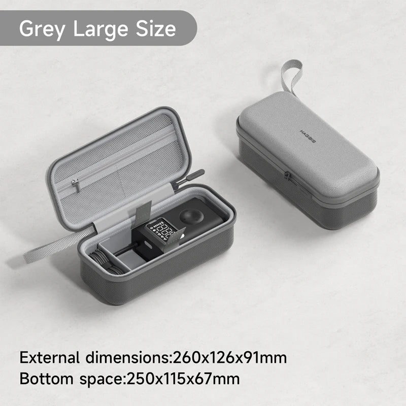 Gray travel case with open lid showing internal compartments on a light gray background