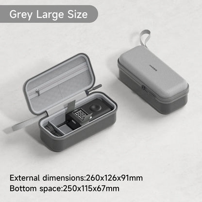 Gray travel case with open lid showing internal compartments on a light gray background