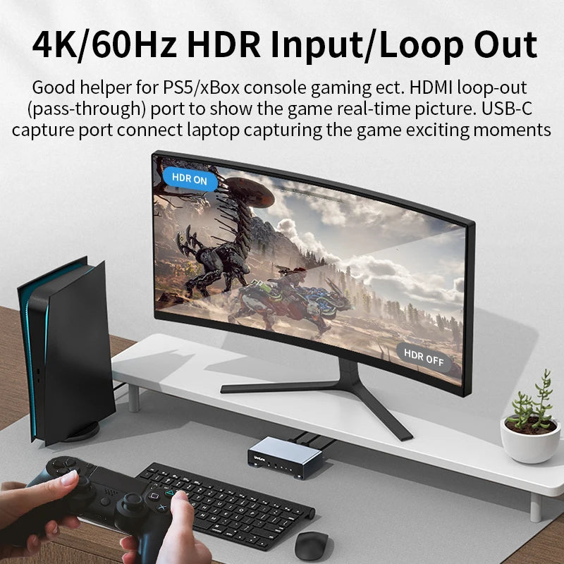 Gaming setup with monitor, console, and gaming controller on a desk.