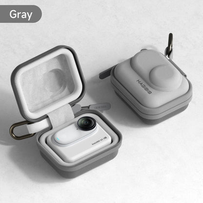 Gray wireless earbuds in a case on a light gray background