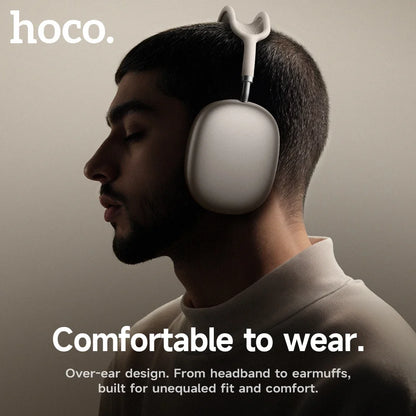Person wearing over-ear headphones with 'hoco.' branding and text about comfort.