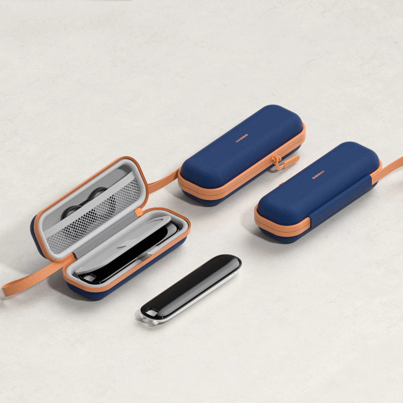 Three navy blue and peach zippered protective cases arranged on a light gray textured background, with one case open to show the interior mesh pocket and one case containing a slim black rectangular accessory.